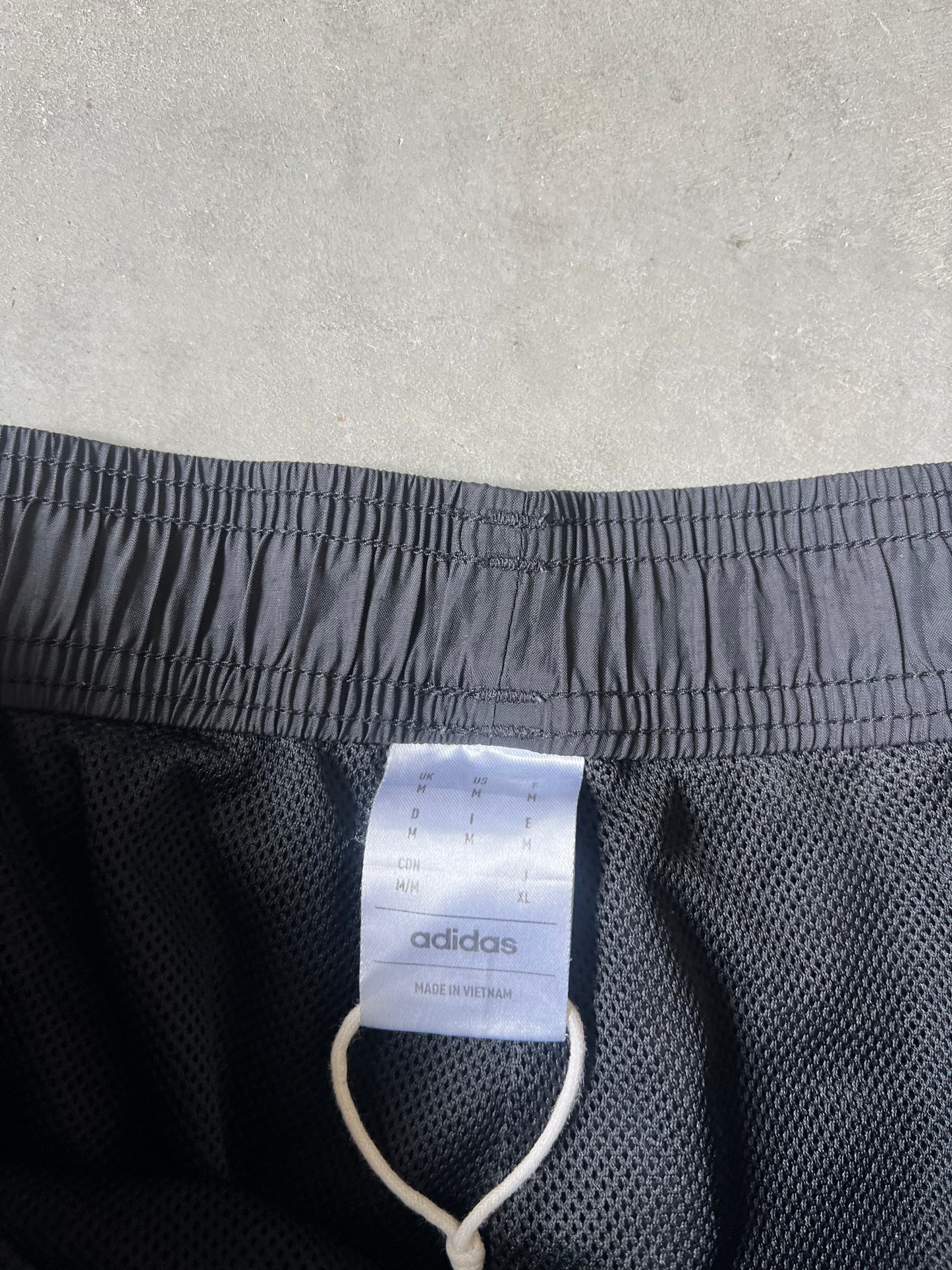 Black adidas stripped track pants - M